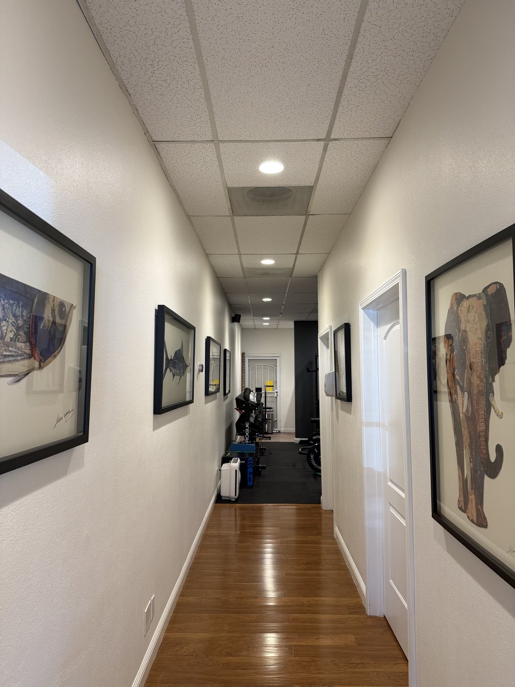 VAL Chiropractic office hallway in San Jose leading to rehabilitation gym